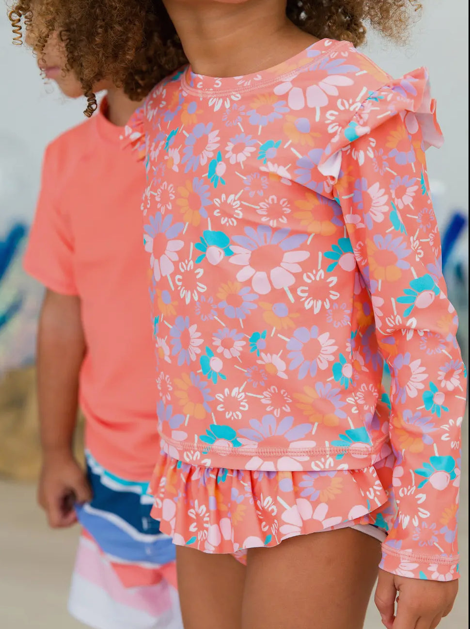 Rufflebutts Coral Floral Flutter Long Sleeve Swimsuit